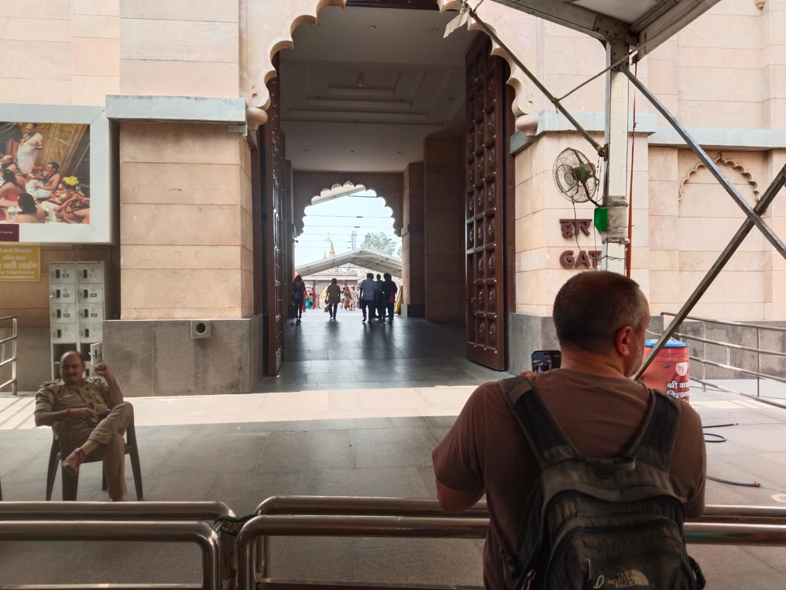 Tourist at Temple Entrance
